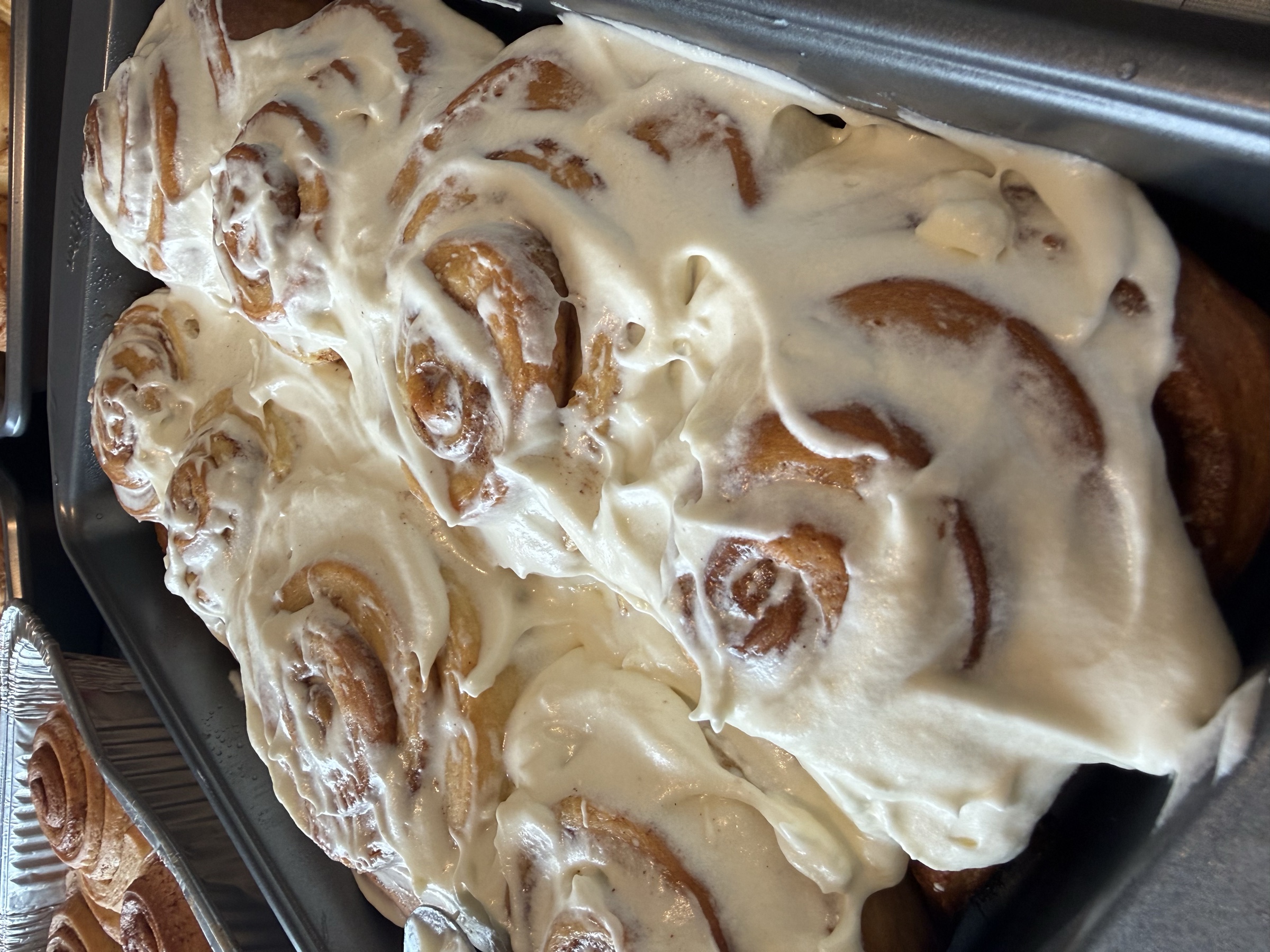 Fresh cinnamon rolls finished with frosting